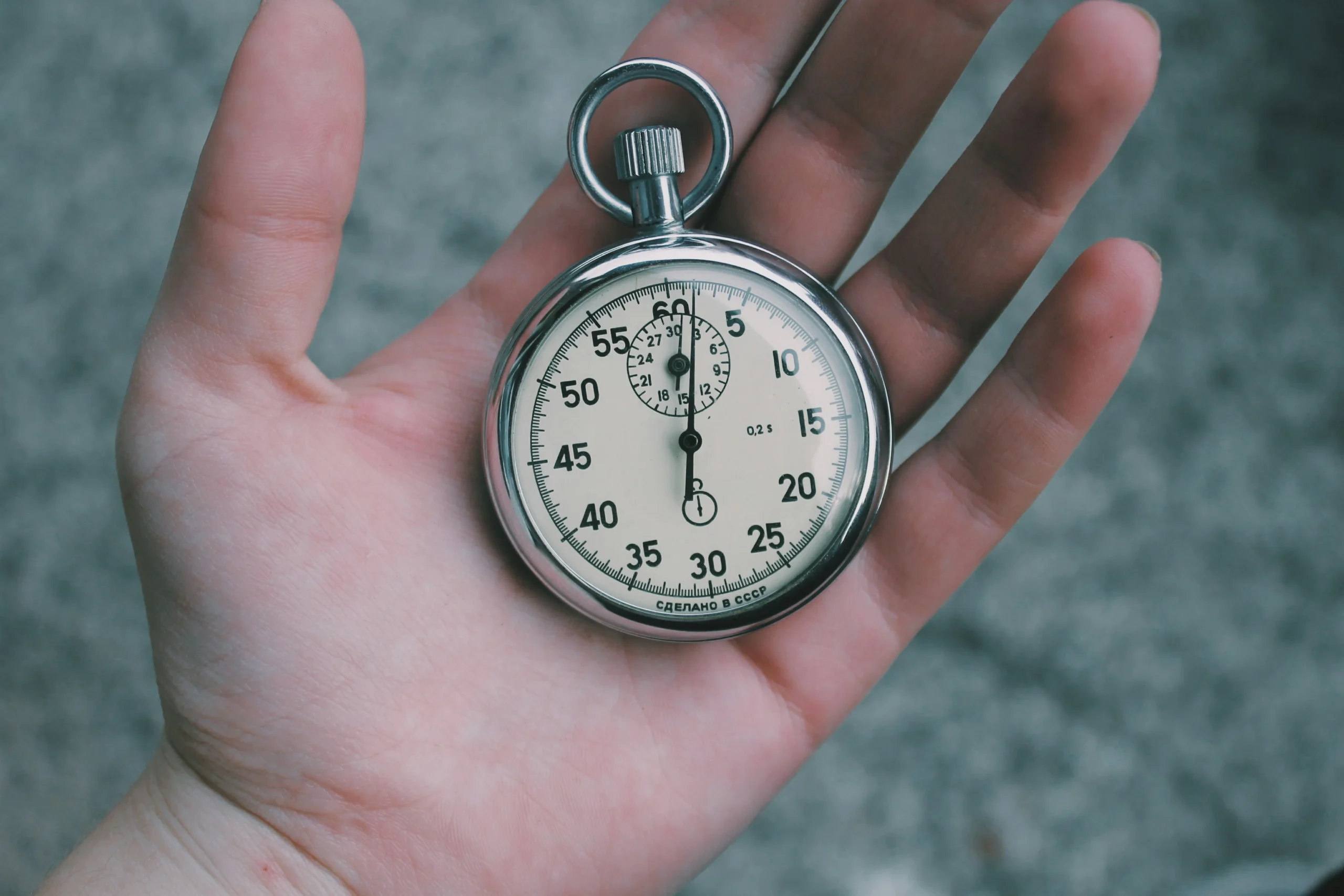 erson-holding-white-and-silver-colored-pocket-watch